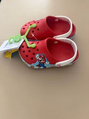 CROCS Kids Red Clog Sandals with White Heel Strap and Super Mario Graphic